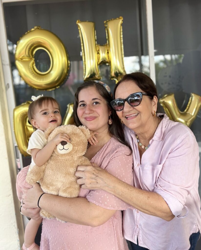 Photo of mother, daughter, and grandma at Gender Reveal Party