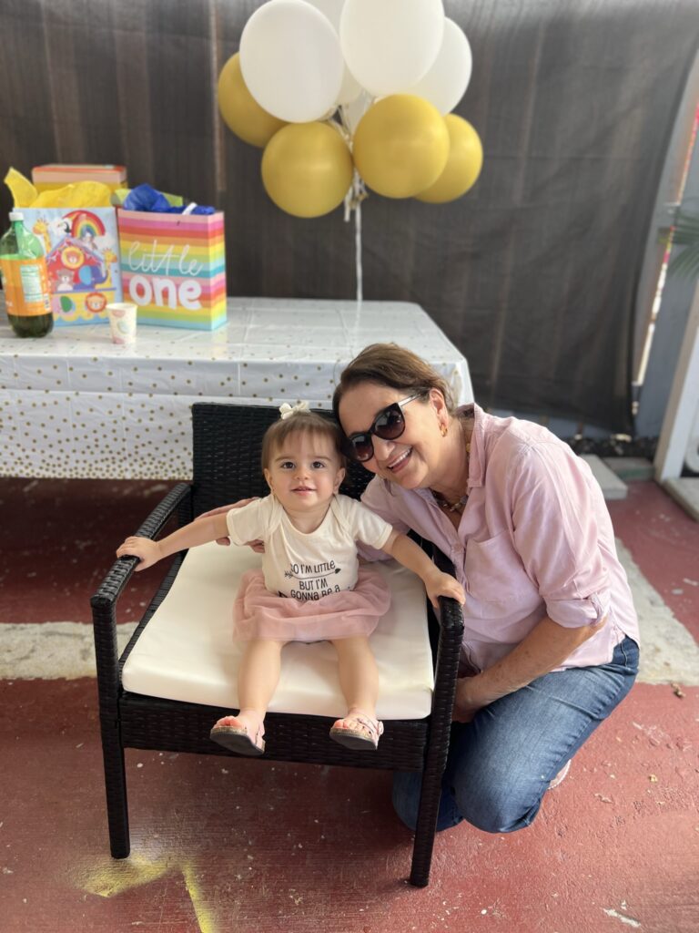Photo of grandchild and grandma at Gender Reveal Party