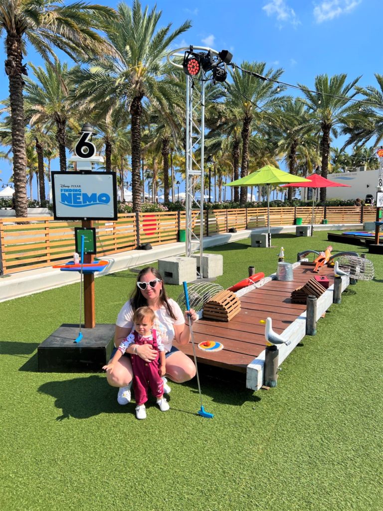 Photo of mother and daughter at Pixar Putt Pop-up Fort Lauderdale