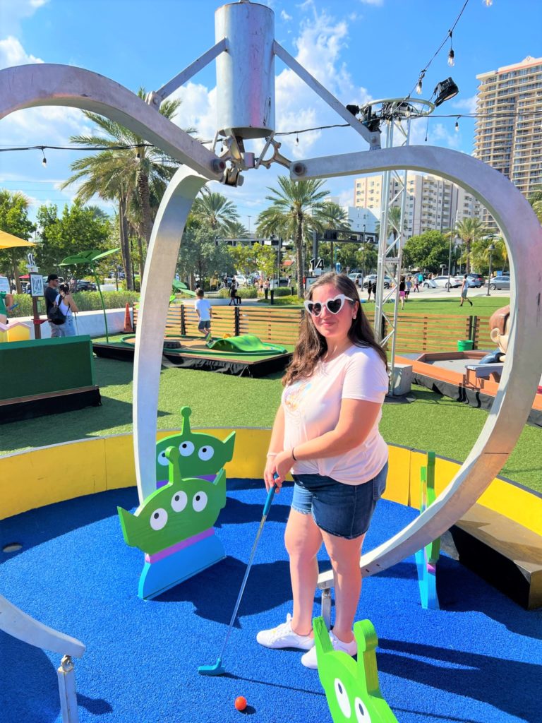Photo of girl playing at Pixar Putt Pop-up Fort Lauderdale