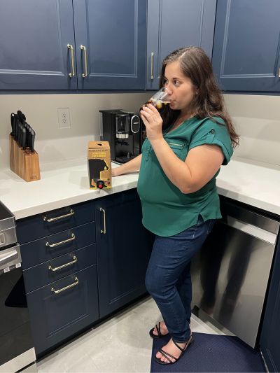 Photo of girl drinking Wandering Bear Cold Brew Coffee