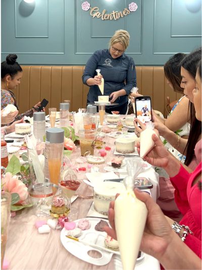 Photo of Chef Sabrina at Bubbles and Buttercream Galentines Event at New River Cafe and Bakery